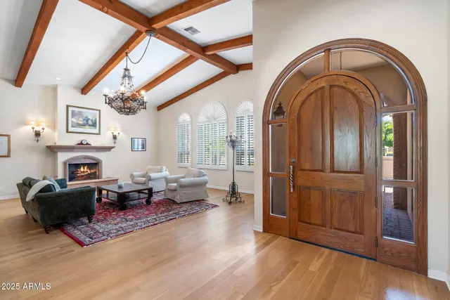 a kitchen with stainless steel appliances granite countertop a sink a stove and a refrigerator