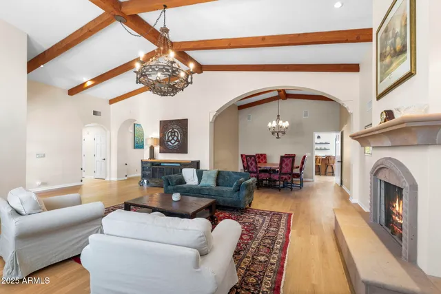 a dining room with furniture garden view and a chandelier