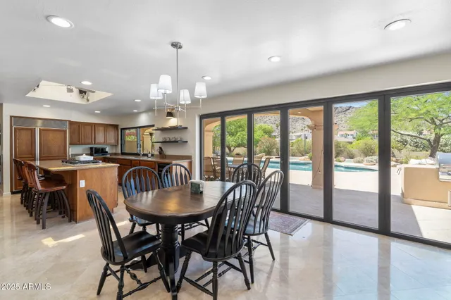 a view of a dining room with furniture window and outside view