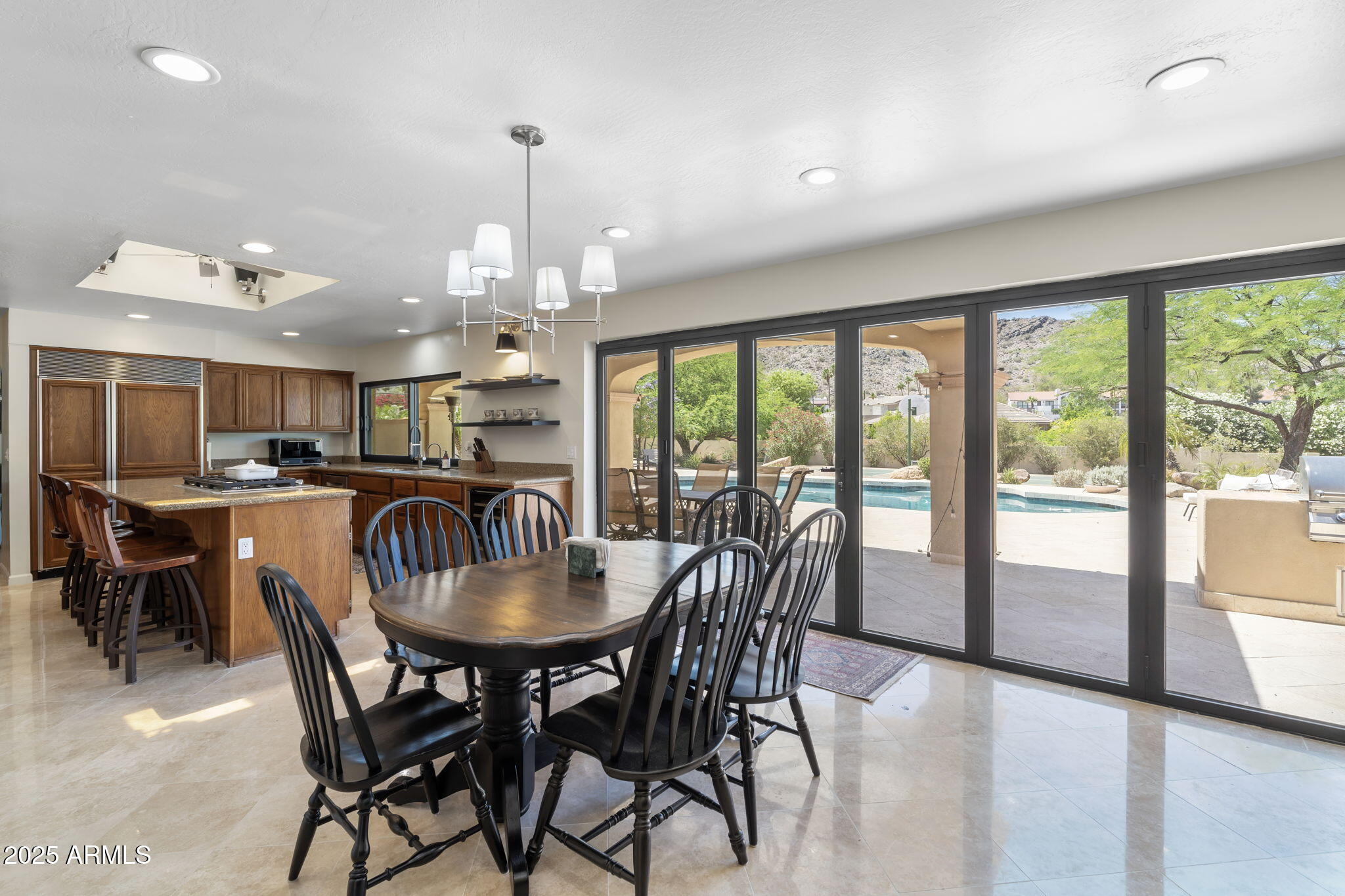 4520 East Horseshoe Road Phoenix, AZ 85028 - Photo 37 of 50 a dining room with furniture garden view and a chandelier