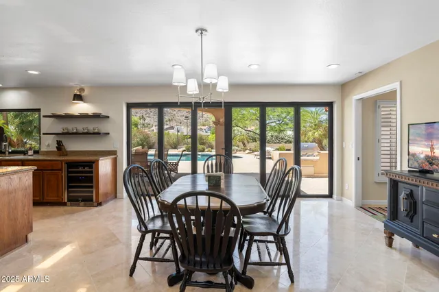 a view of a workspace with furniture window and wooden floor