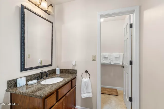 a bedroom with a bed and a tv