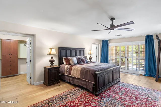 a bed room with a bed and a television