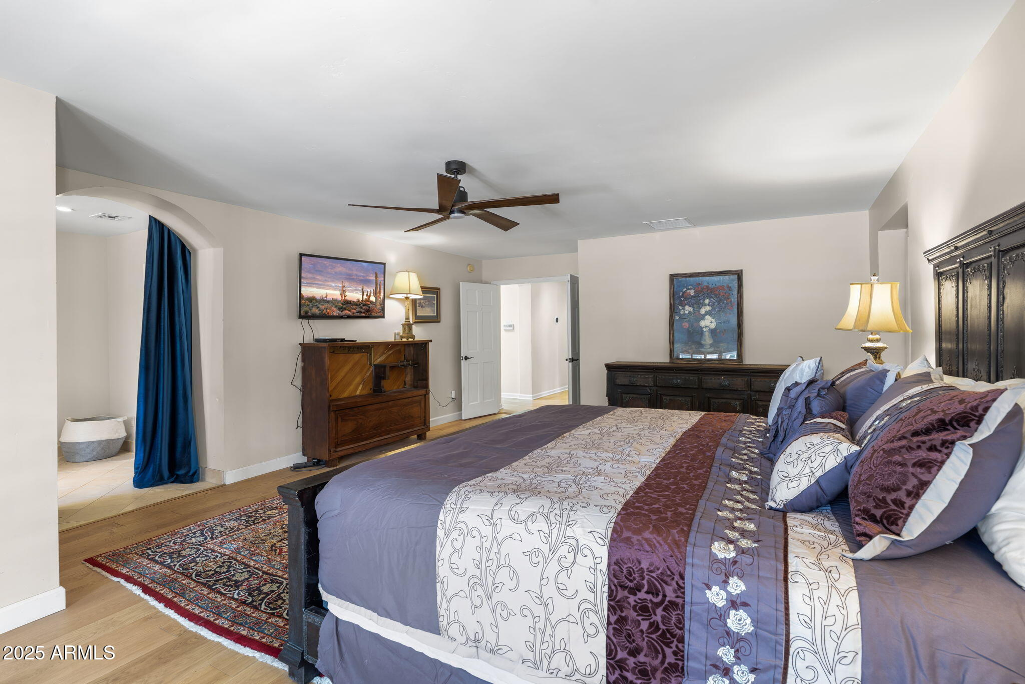 4520 East Horseshoe Road Phoenix, AZ 85028 - Photo 45 of 50 a bed room with a bed and a television