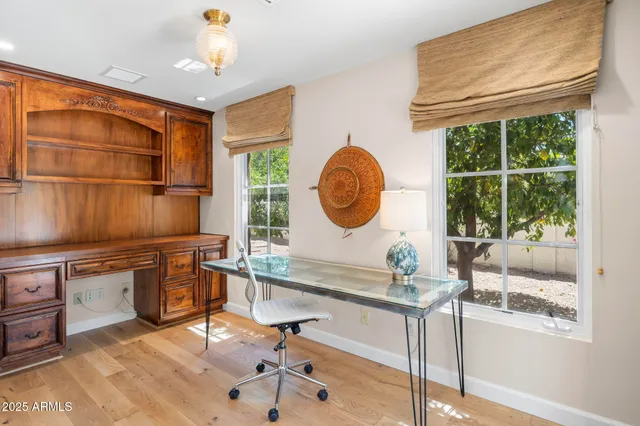 a view of a bedroom with a bed and glass door