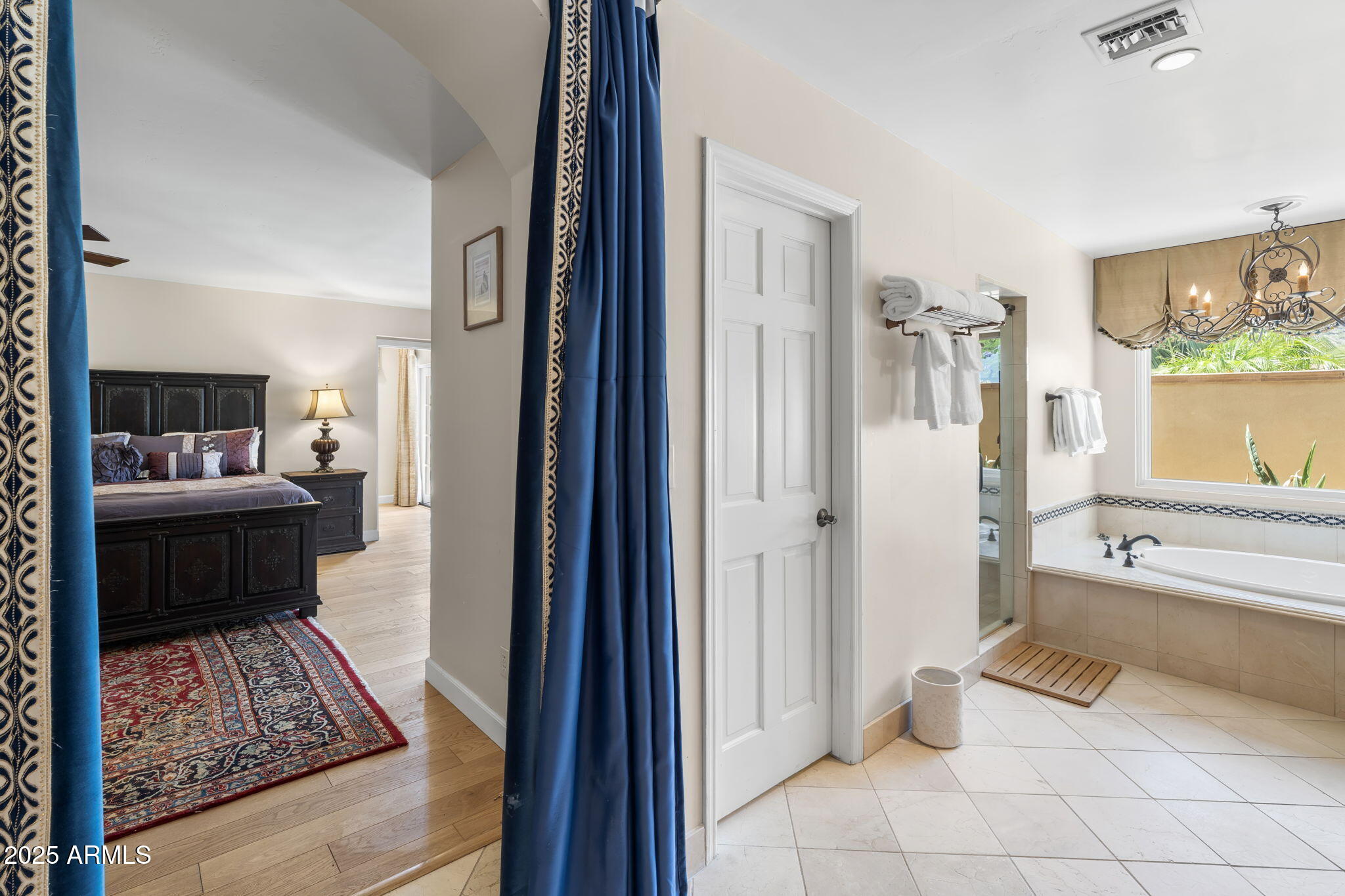 4520 East Horseshoe Road Phoenix, AZ 85028 - Photo 49 of 50 a view of a bedroom with a bed and glass door