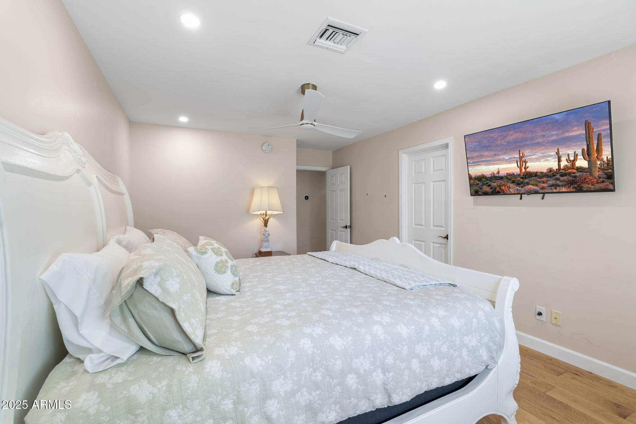 4520 East Horseshoe Road Phoenix, AZ 85028 - Photo 5 of 50 a bedroom with a bed and a tv