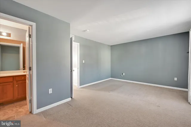 a view of an empty room and a window