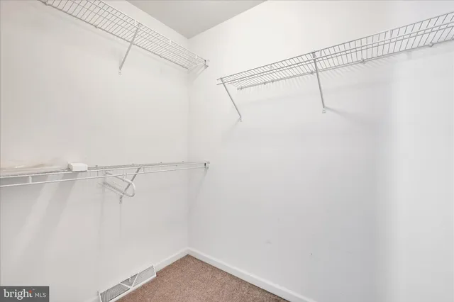 a bathroom with a sink a toilet a shower and a mirror