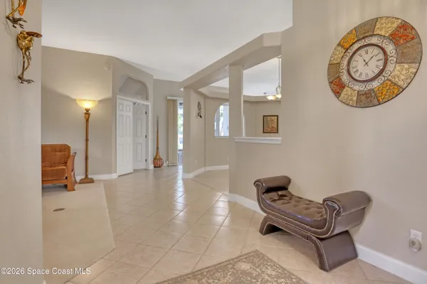 a living room with furniture and a rug