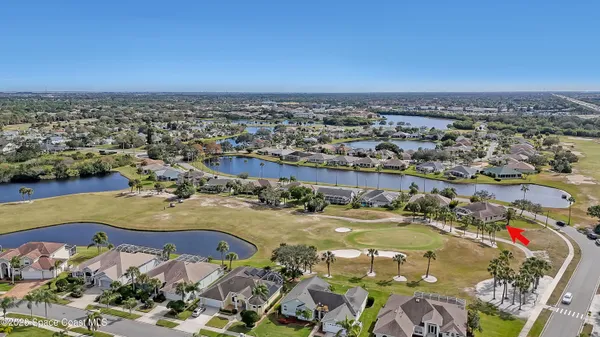 an aerial view of a residential houses with outdoor space