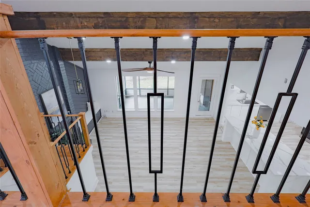 a view of a house with a tree in front of it