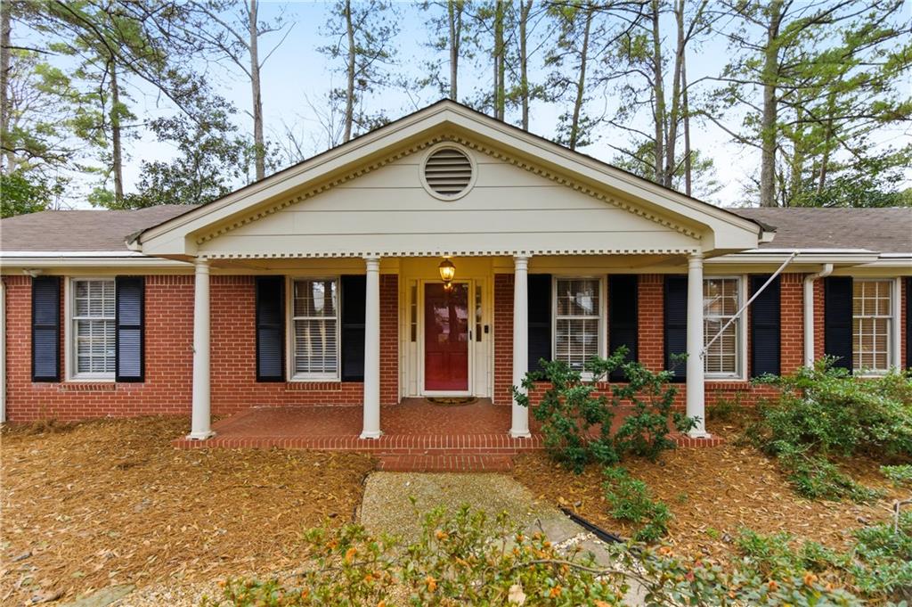3698 Embry Circle Chamblee, GA 30341 - Photo 1 of 20 a front view of a house with garden