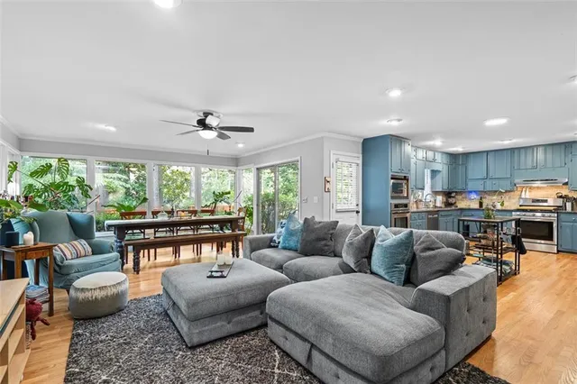 a living room with furniture and a large window