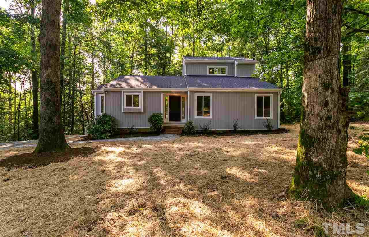1016 Reca Road Garner, NC 27529 - Photo 3 of 25 a house with trees in front of it