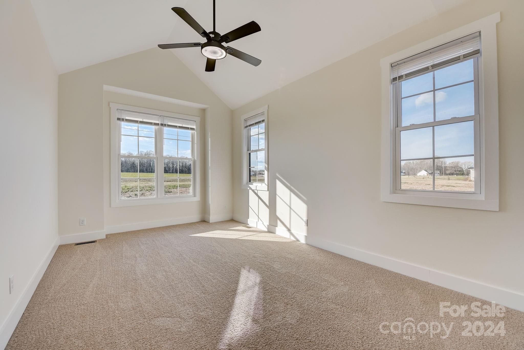 315 Cal Kennedy Road Cleveland, NC 27013 - Photo 16 of 39 a view of a livingroom with a ceiling fan and window