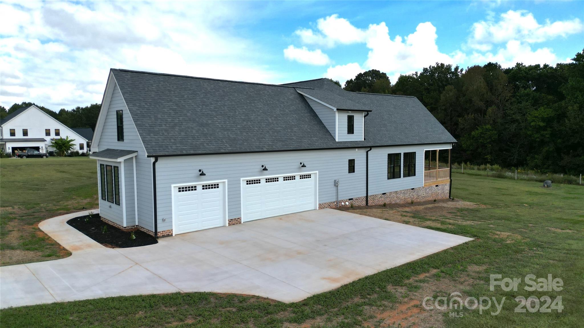 315 Cal Kennedy Road Cleveland, NC 27013 - Photo 2 of 39 a front view of a house with garden