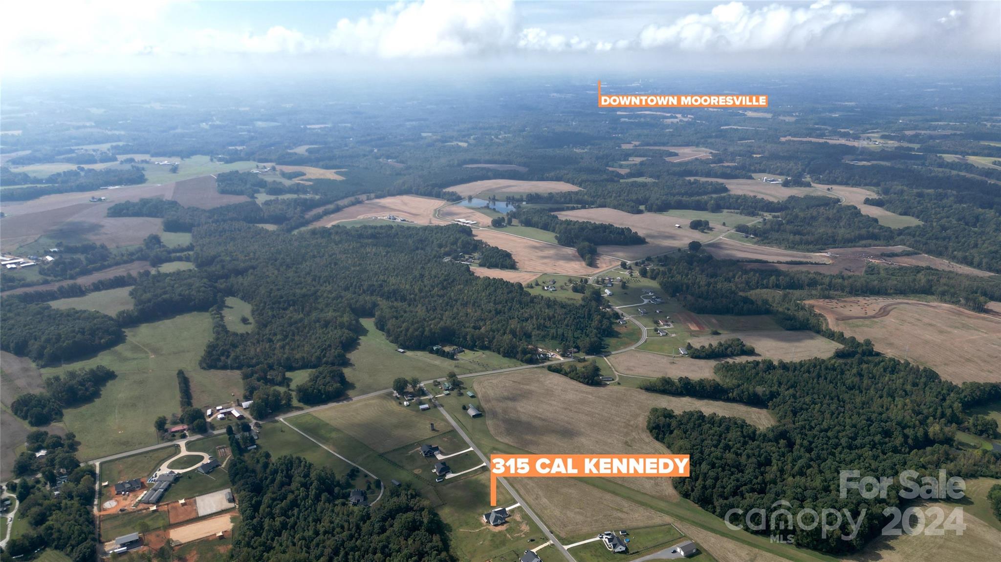 315 Cal Kennedy Road Cleveland, NC 27013 - Photo 35 of 39 an aerial view of residential houses with outdoor space
