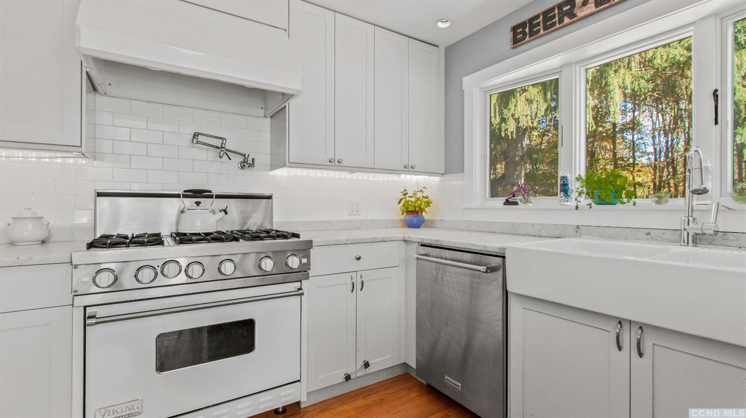 385 Red Top Road Highland, NY 12528 - Photo 15 of 36 a kitchen with a stove a sink and a window