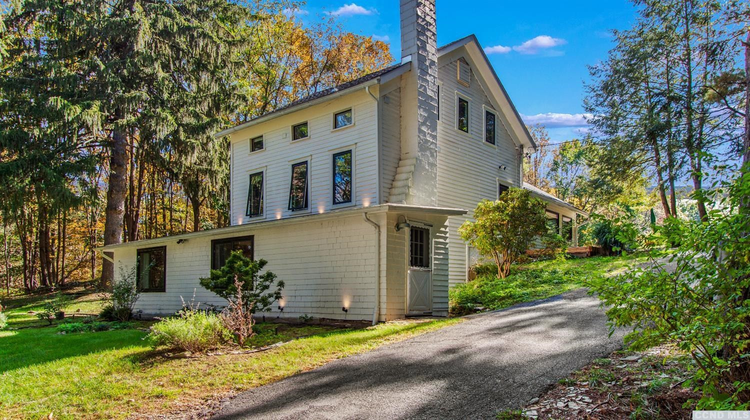 385 Red Top Road Highland, NY 12528 - Photo 2 of 36 a front view of a house with a yard and garage