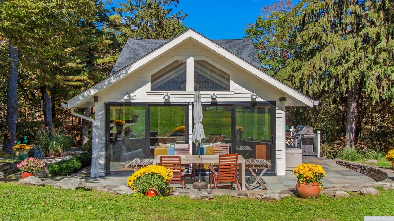 385 Red Top Road Highland, NY 12528 - Photo 29 of 36 a view of a patio with table and chairs potted plants and large tree