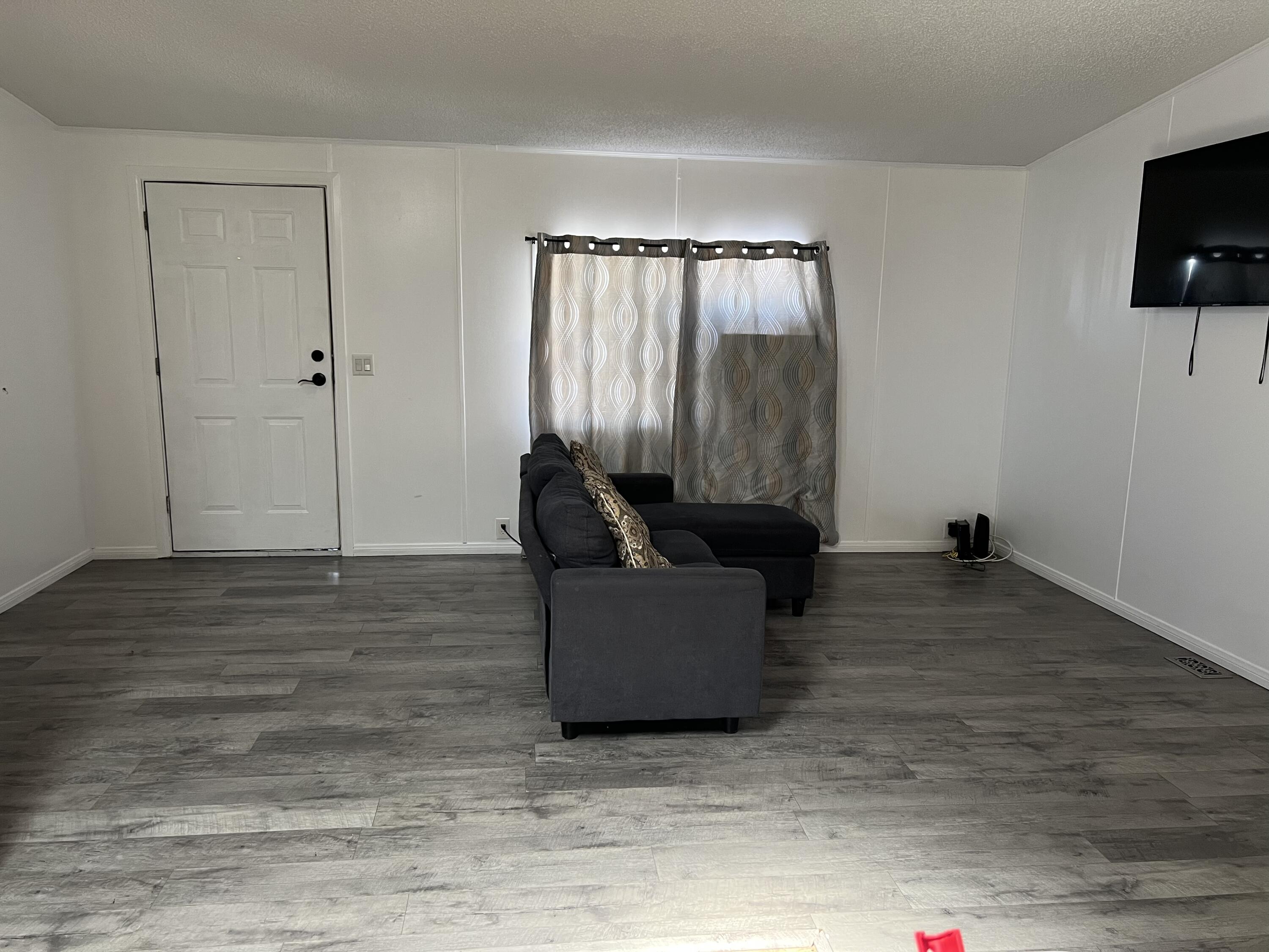 2005 Windcurrent Drive Rosamond, CA 93560 - Photo 5 of 13 a living room with furniture and a flat screen tv