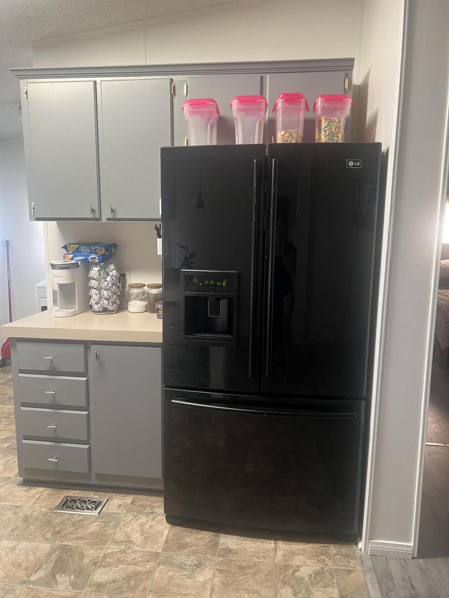 2005 Windcurrent Drive Rosamond, CA 93560 - Photo 7 of 13 a kitchen with refrigerator and cabinets