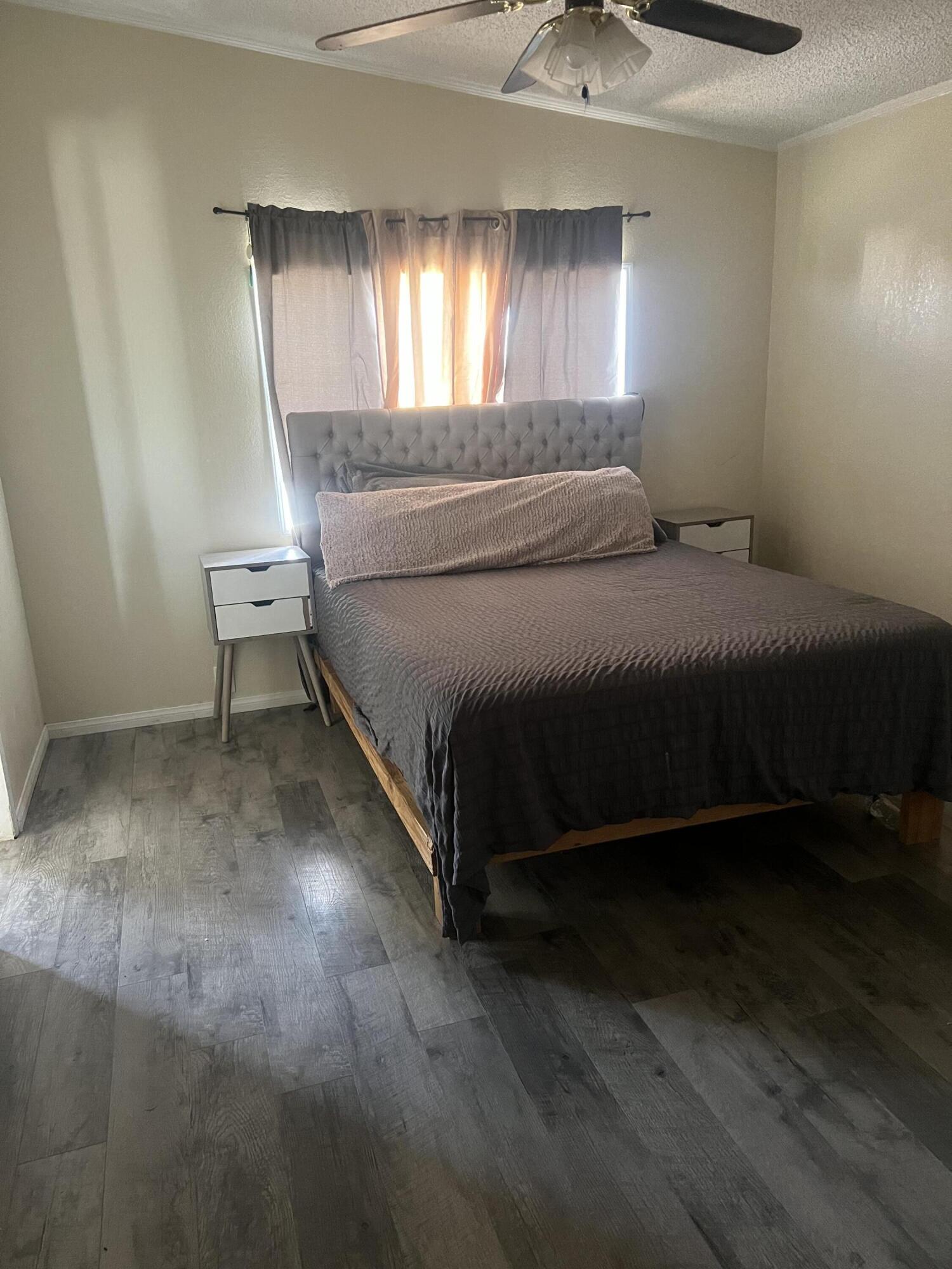 2005 Windcurrent Drive Rosamond, CA 93560 - Photo 8 of 13 a bed sitting in a room next to a window