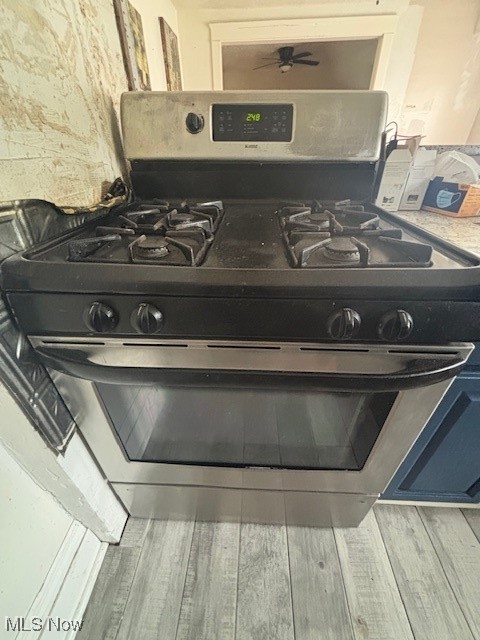 805 Rudyard Road Cleveland, OH 44110 - Photo 10 of 45 Kitchen view of stainless steel gas range oven and wood finished floors