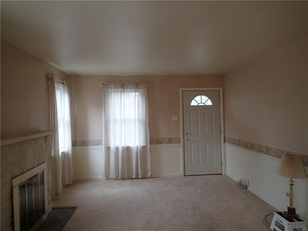 642 Reno Street Rochester, PA 15074 - Photo 13 of 25 The living room with fireplace!