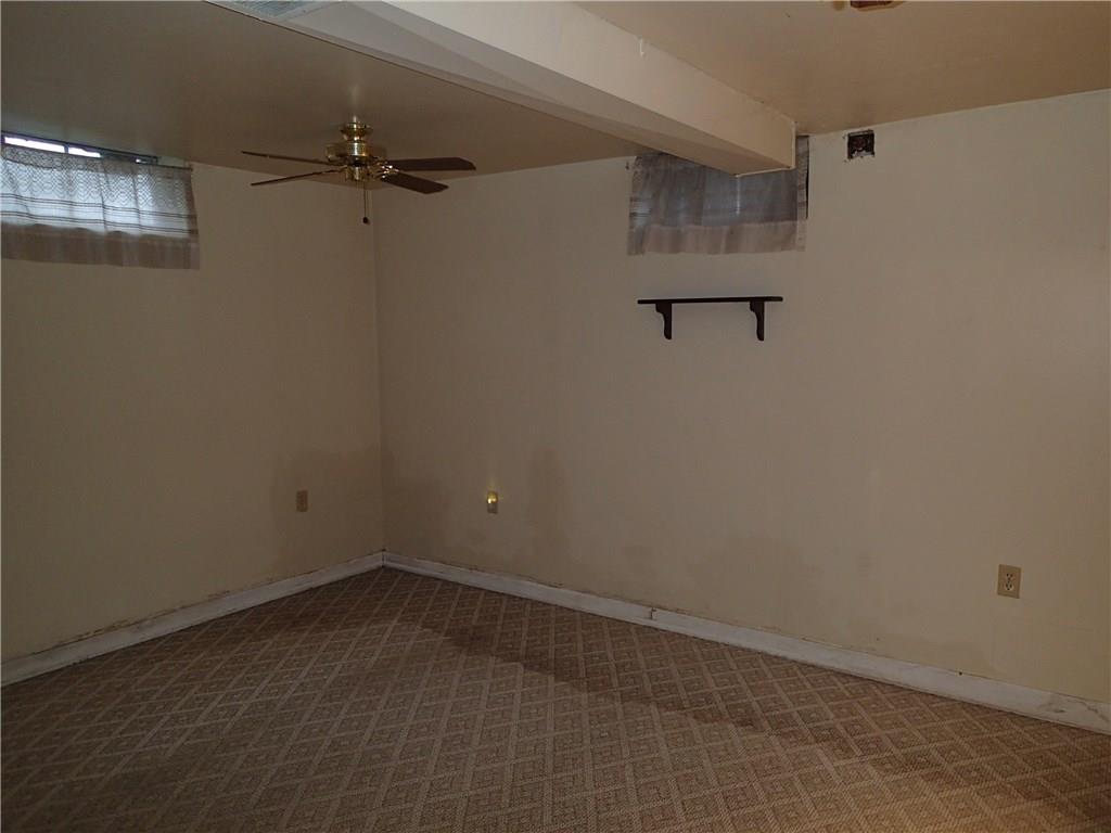642 Reno Street Rochester, PA 15074 - Photo 25 of 25 This is the rear of basement was a small family room. New buyer will need to address "wet issue". Home being sold as-is. Large Room at Front of basement had french drains and sump pump added see pictures front of basement