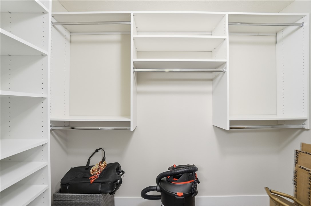 605 Cape Cod Court Beavercreek, OH 45430 - Photo 41 of 54 This spacious closet features ample shelving and hanging rods for organized storage.