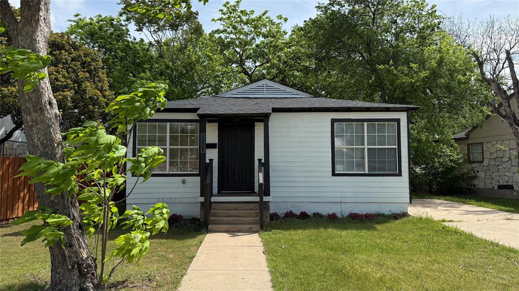 2012 Tennessee Avenue Dallas, TX 75224 - Photo 2 of 19 a front view of a house with garden