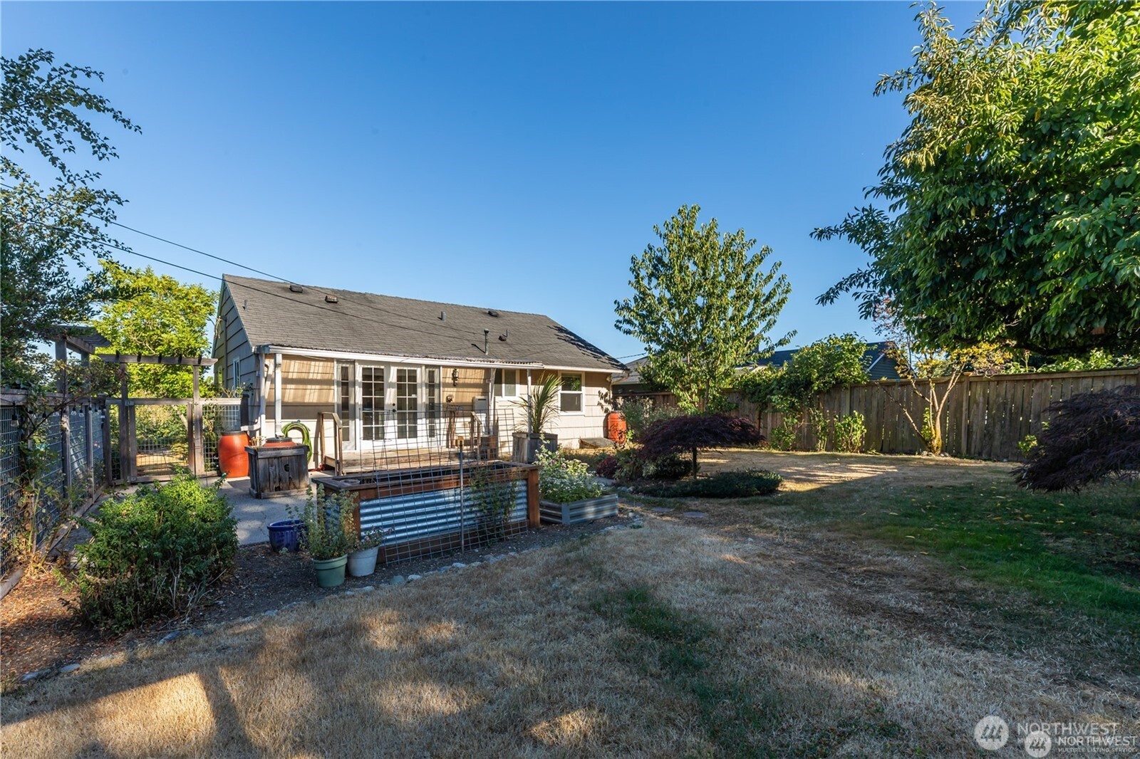 8601 36th Avenue Southwest Seattle, WA 98126 - Photo 22 of 28 a view of backyard with deck and outdoor seating