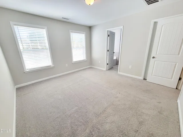 a bathroom with a sink vanity and mirror