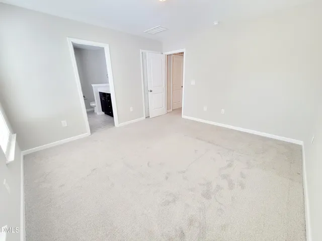 a bath tub sitting in a bathroom next to a window
