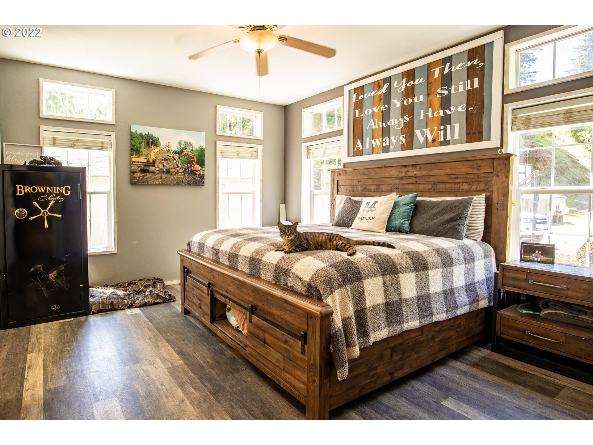 1578 Scholfield Road Reedsport, OR 97467 - Photo 12 of 37 a bed sitting in a bedroom next to a window