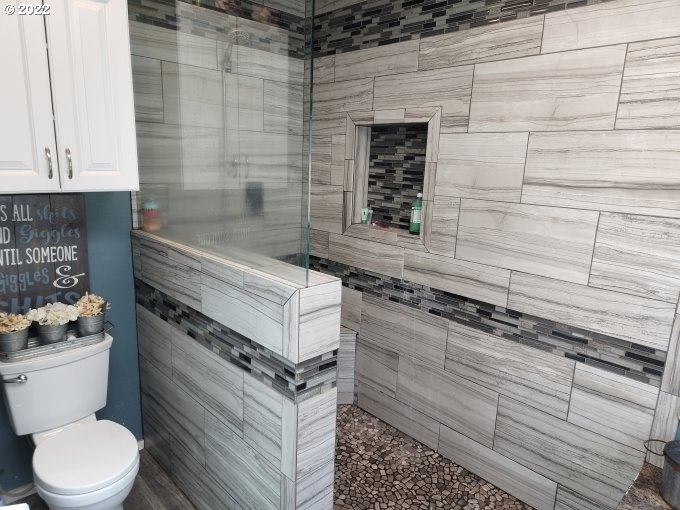 1578 Scholfield Road Reedsport, OR 97467 - Photo 15 of 37 a bathroom with a sink a toilet and shower
