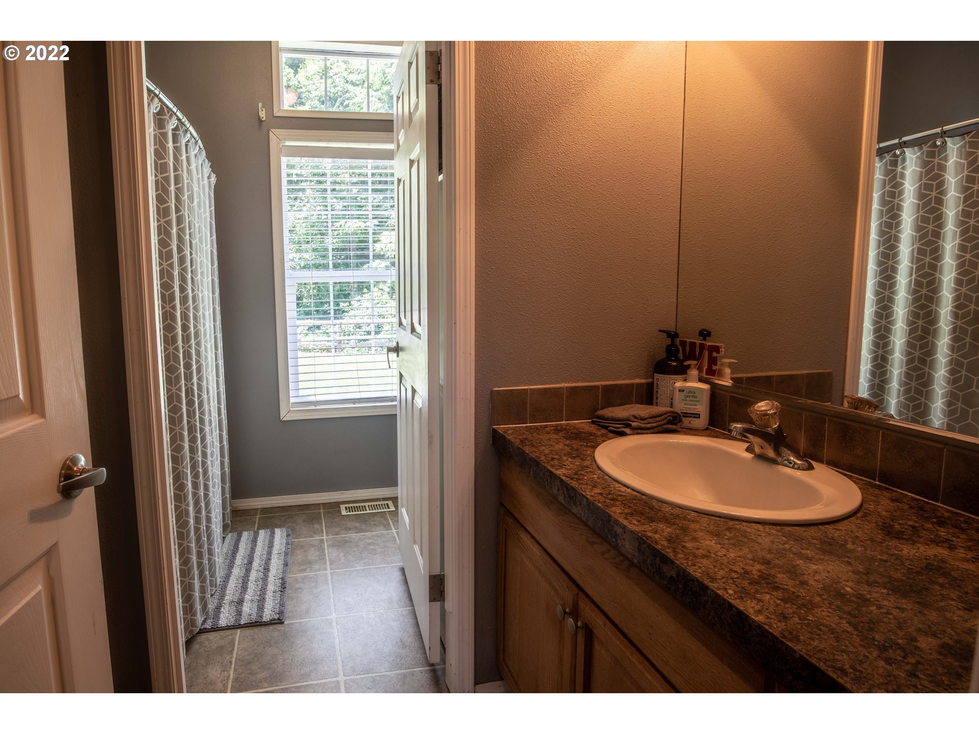 1578 Scholfield Road Reedsport, OR 97467 - Photo 18 of 37 a bathroom with a sink and a mirror