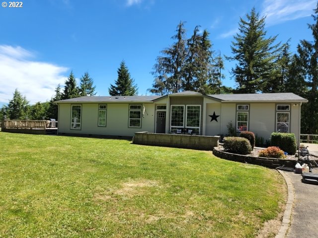 1578 Scholfield Road Reedsport, OR 97467 - Photo 2 of 37 a house view with a sitting space and garden