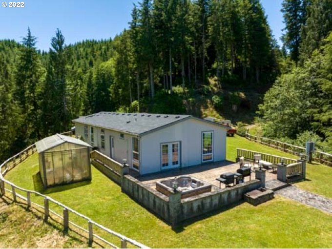 1578 Scholfield Road Reedsport, OR 97467 - Photo 29 of 37 a view of a house with pool and chairs