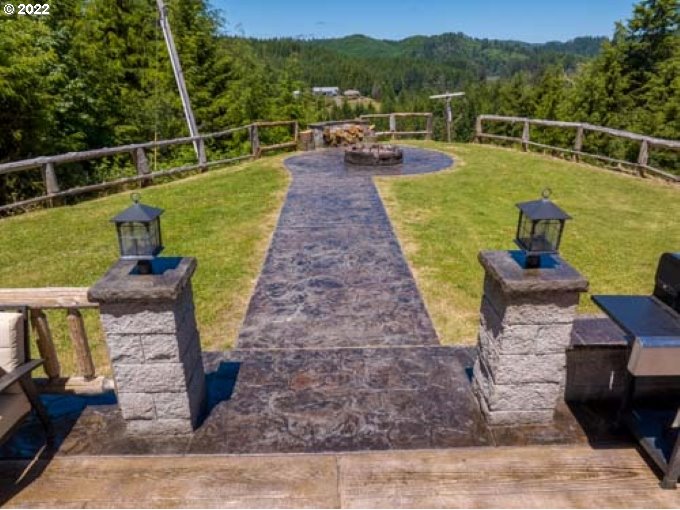 1578 Scholfield Road Reedsport, OR 97467 - Photo 3 of 37 a view of a garden with lawn chairs