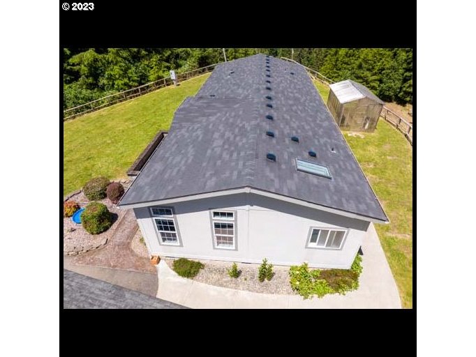 1578 Scholfield Road Reedsport, OR 97467 - Photo 33 of 37 a view of a house with a balcony