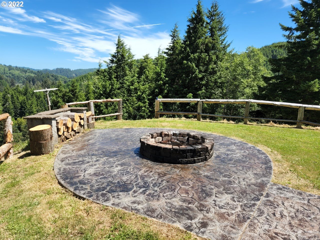 1578 Scholfield Road Reedsport, OR 97467 - Photo 4 of 37 a view of a swimming pool with a chairs and plants