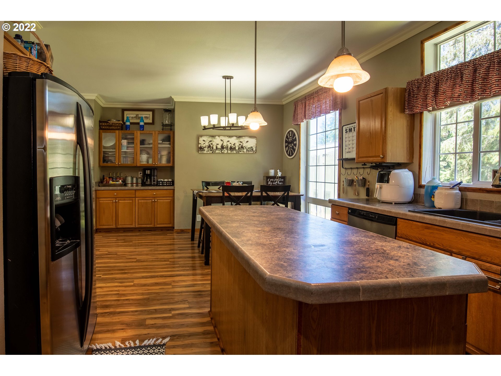 1578 Scholfield Road Reedsport, OR 97467 - Photo 8 of 37 a kitchen with stainless steel appliances granite countertop a sink refrigerator and cabinets
