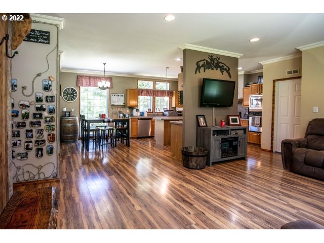 1578 Scholfield Road Reedsport, OR 97467 - Photo 10 of 37 a living room with furniture and a flat screen tv