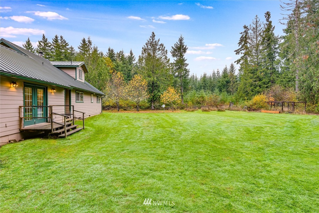 454 Harmon Road, Unit 26 Chehalis, WA 98532 - Photo 29 of 35 a view of a house with a yard and sitting area