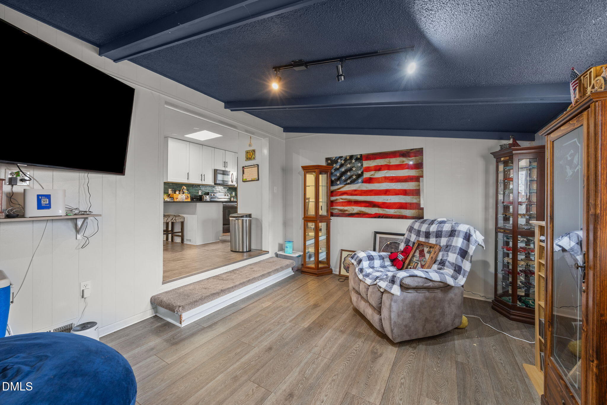 317 Clapp Street Graham, NC 27253 - Photo 15 of 33 a living room with furniture and a flat screen tv