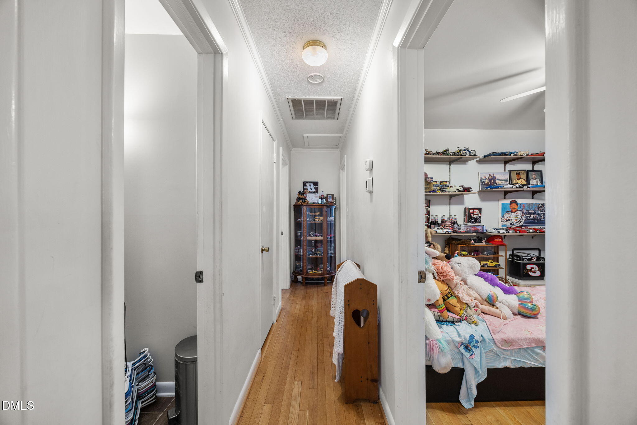 317 Clapp Street Graham, NC 27253 - Photo 18 of 33 a view of walk in closet with clothes and shoes