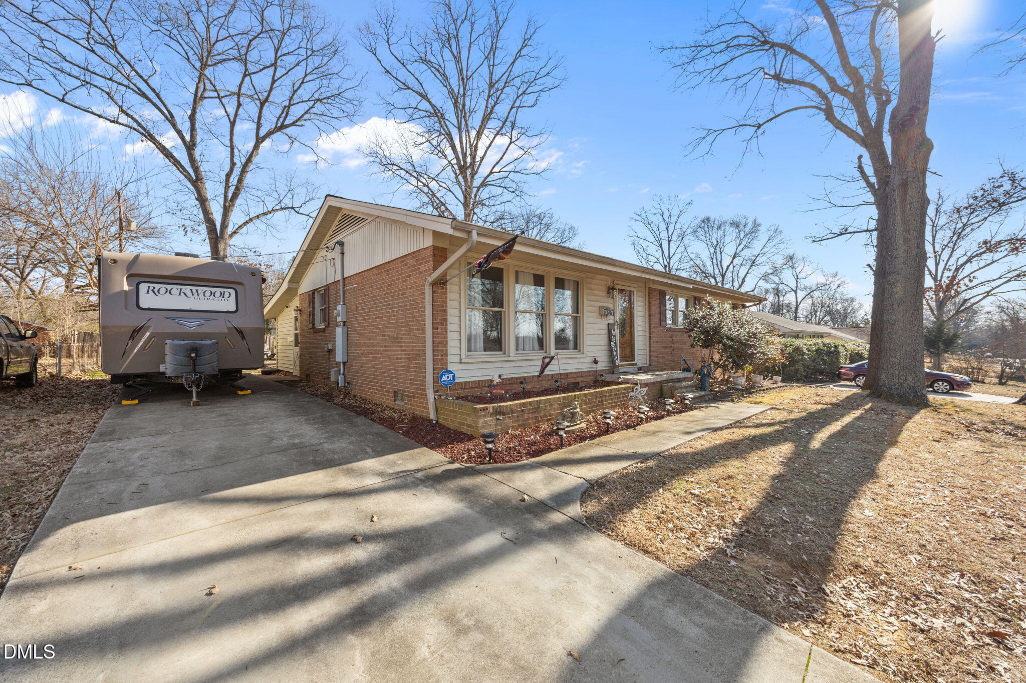 317 Clapp Street Graham, NC 27253 - Photo 24 of 33 a view of a house with a yard covered in snow